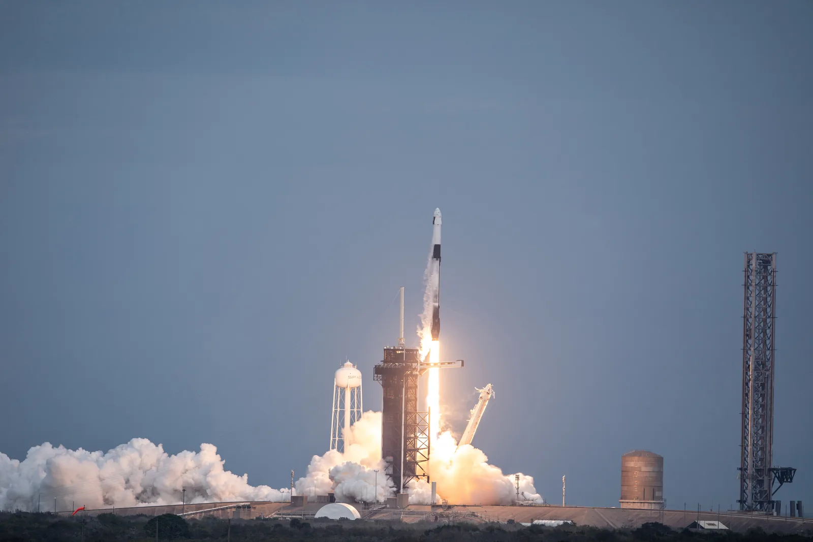 SpaceX Falcon 9 lifting off from Kennedy Space Center carrying Dragon for Axiom Space's Ax-3 private astronaut mission, January 2024