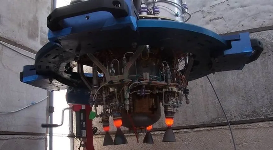 Benchmark's Halcyon Avant propulsion system mounted in a test stand with its peroxide thrusters glowing during a hot-fire test