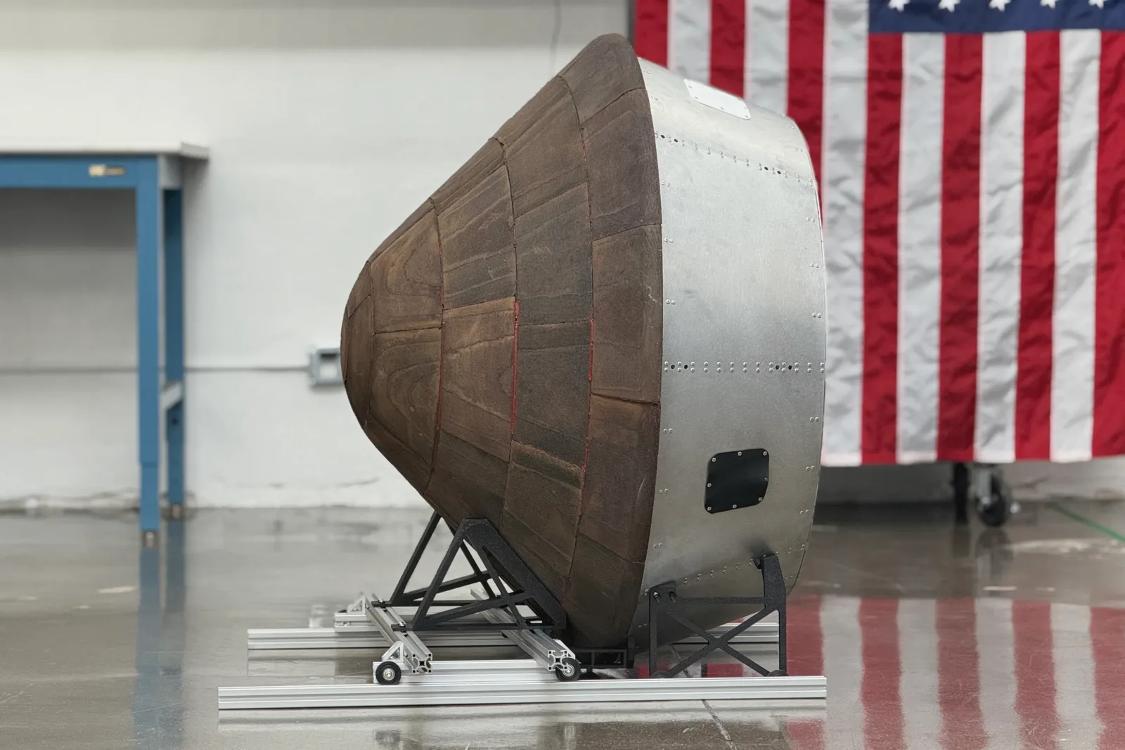 Full-scale Spark-1 capsule prototype on a cradle in a hangar