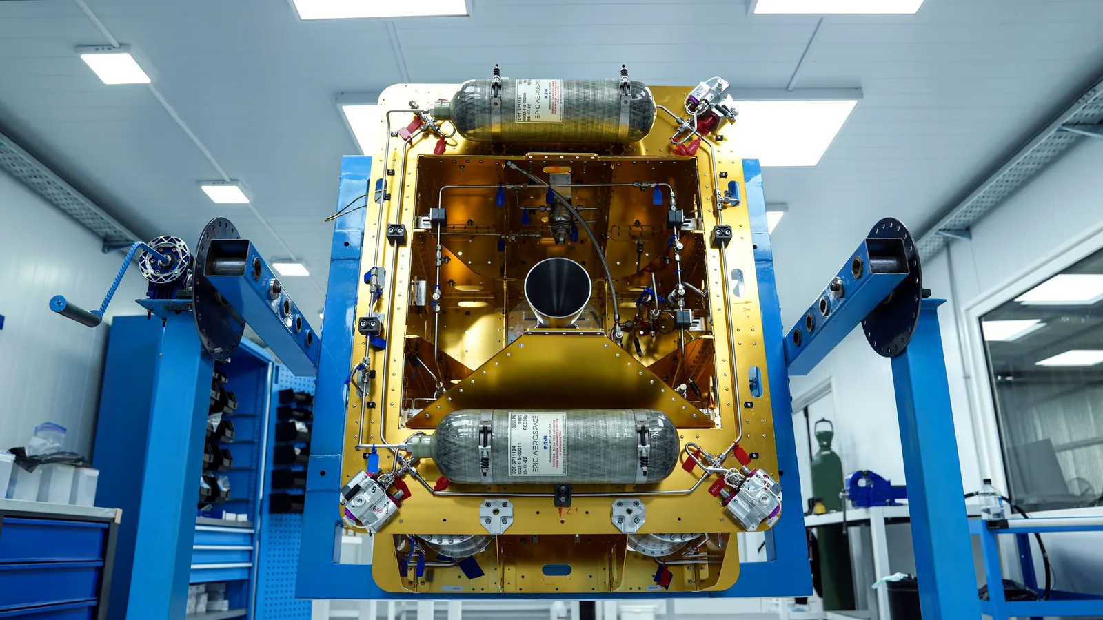 CHIMERA LEO space tug with gold structure and propellant tanks on a stand in a cleanroom