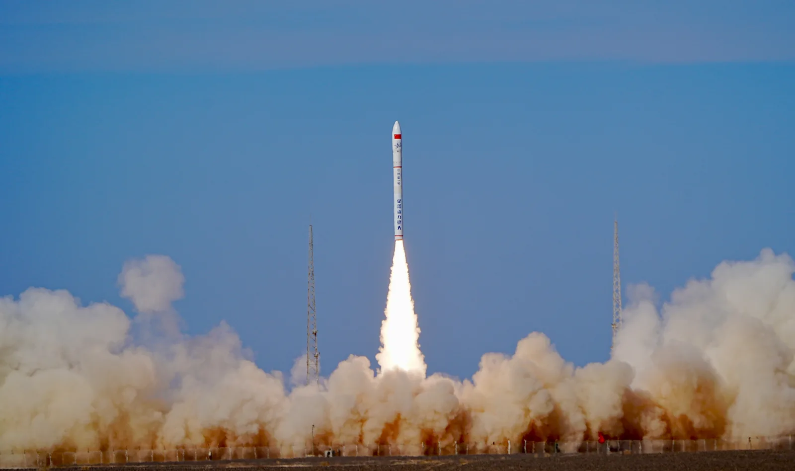 Ceres-1 rocket lifting off from its launch pad in a cloud of exhaust under a blue sky