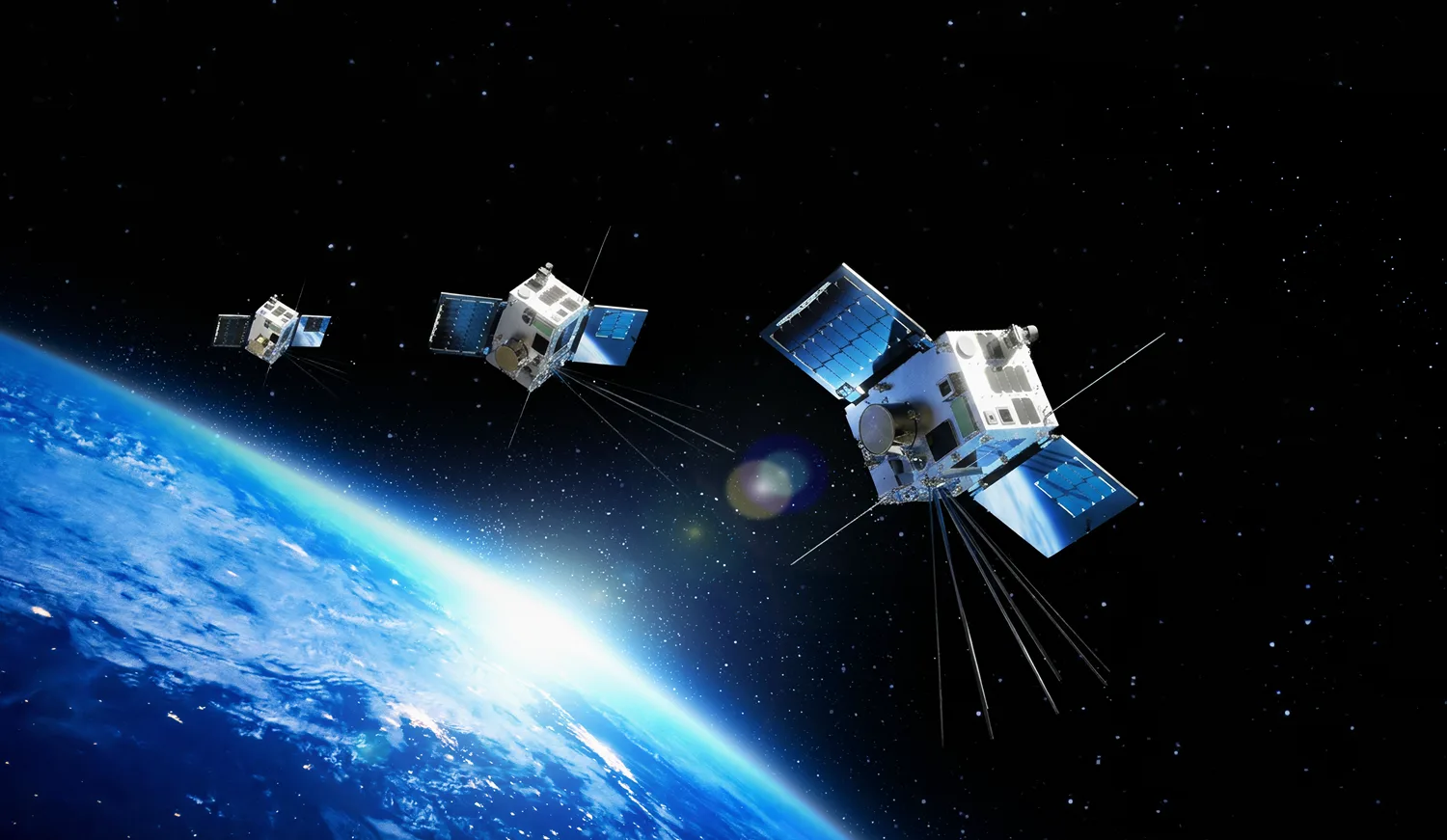 Rendering of three HawkEye 360 Cluster 15 radio-frequency sensing satellites flying in formation above Earth