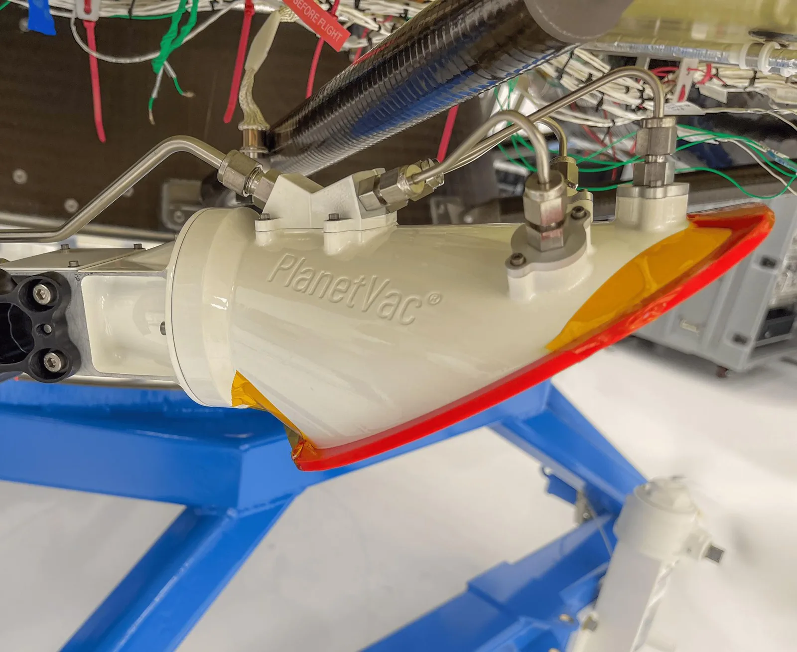 Close-up of the Lunar PlanetVac sampling head mounted on a lunar lander leg
