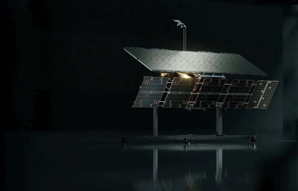 An ICEYE Gen4 radar satellite with its antenna panel deployed, shown on a stand