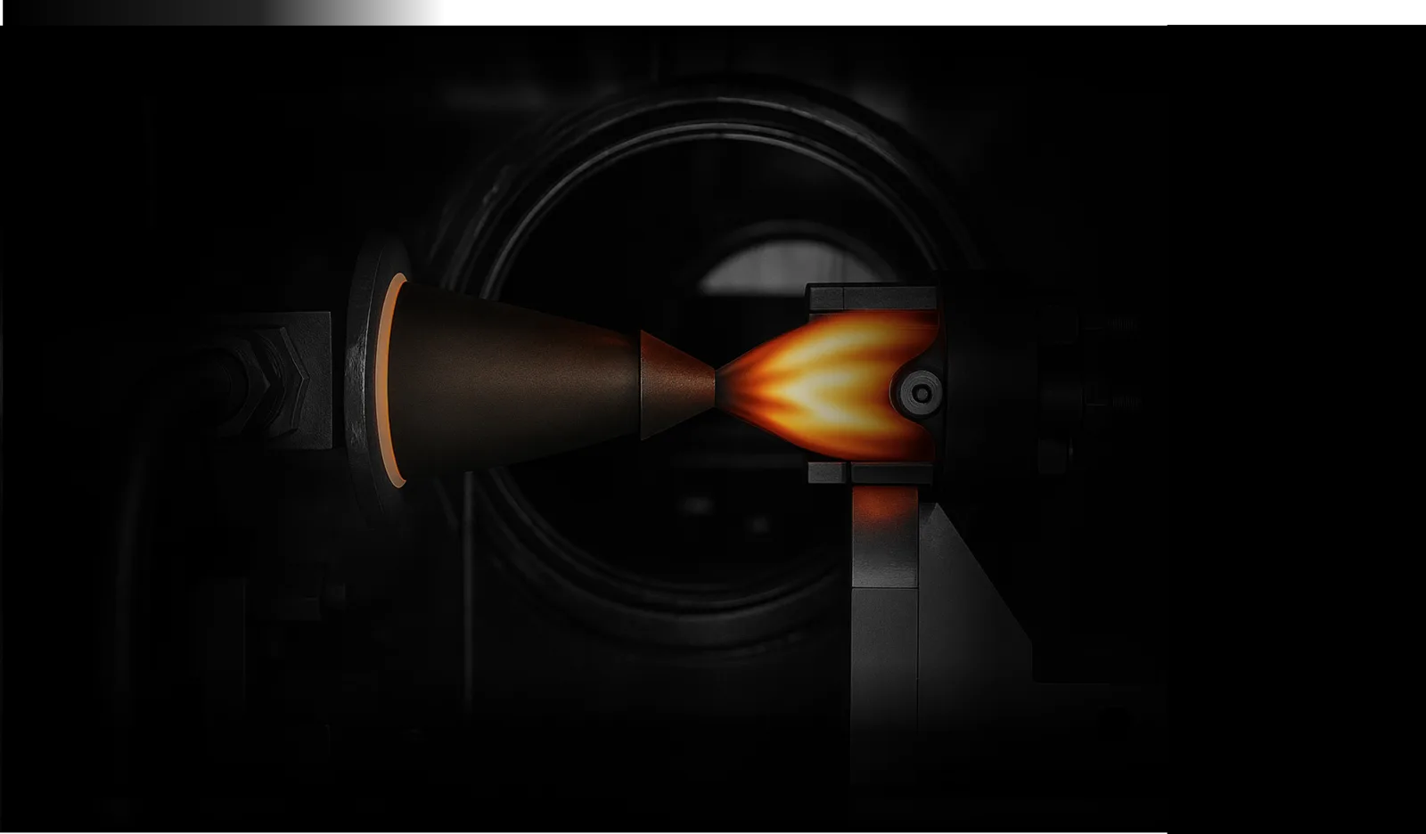 InterGravity thruster firing with an orange exhaust plume inside a vacuum test chamber