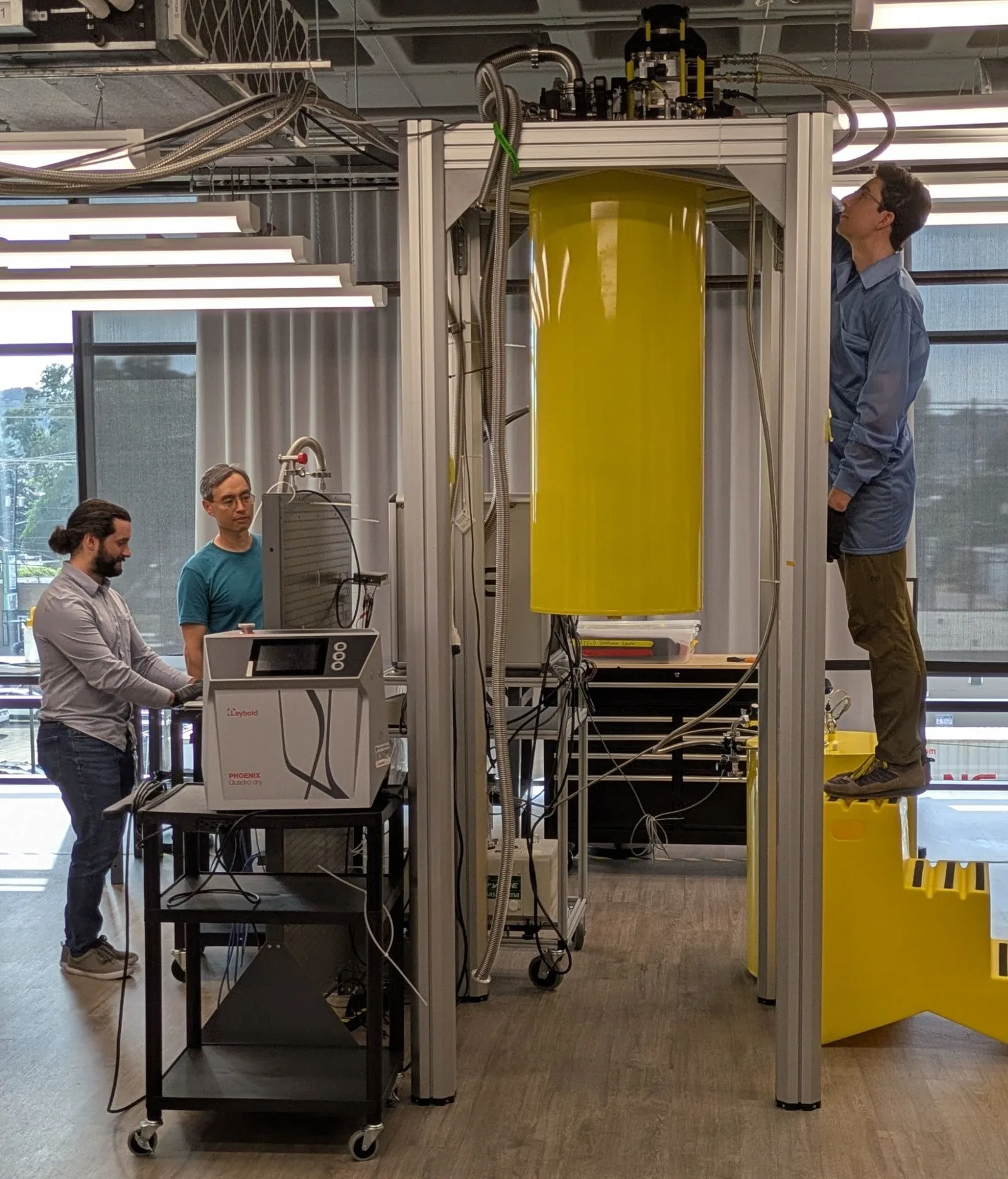 Interlune engineers working on the cryogenic helium-3 separation system in the lab