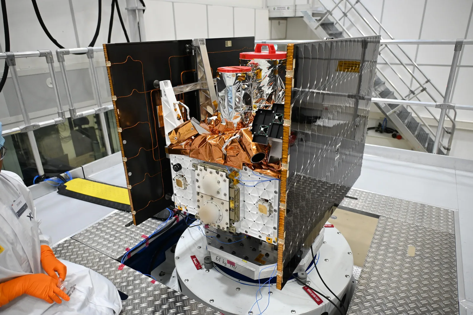 Marble Imaging satellite with folded solar panels mounted on a test stand in a cleanroom
