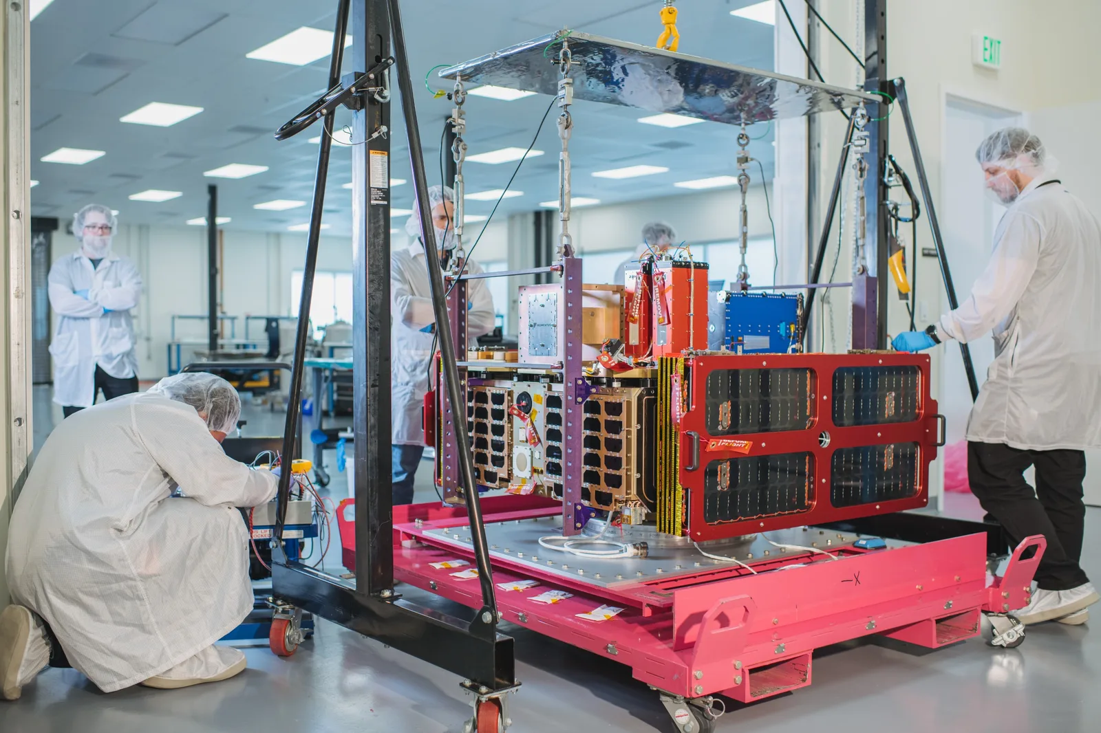Momentus Vigoride orbital service vehicle being prepared by technicians in a cleanroom