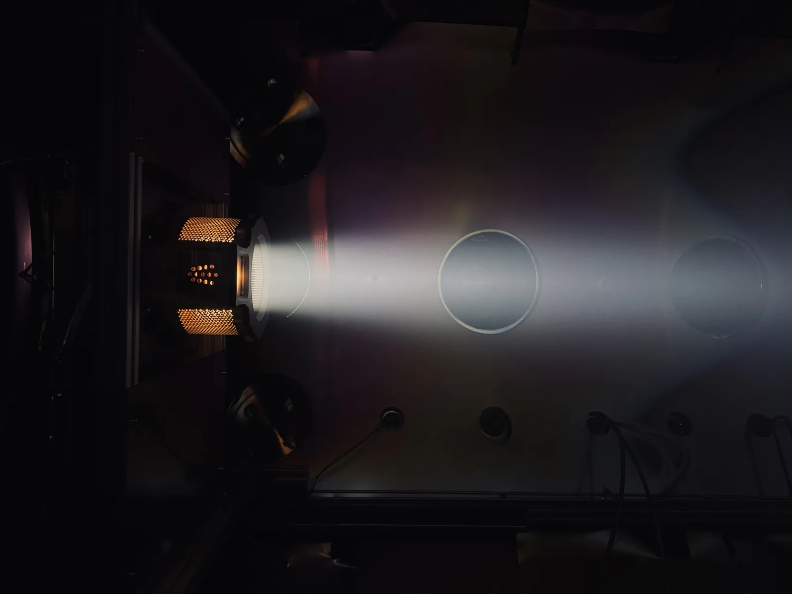 NewOrbit AURA air-breathing electric thruster firing in a vacuum test chamber