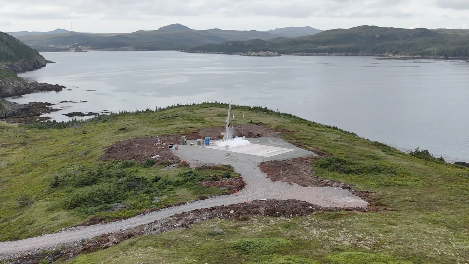 Aerial view of the NordSpace launch pad on a coastal headland at the Atlantic Spaceport Complex in Newfoundland