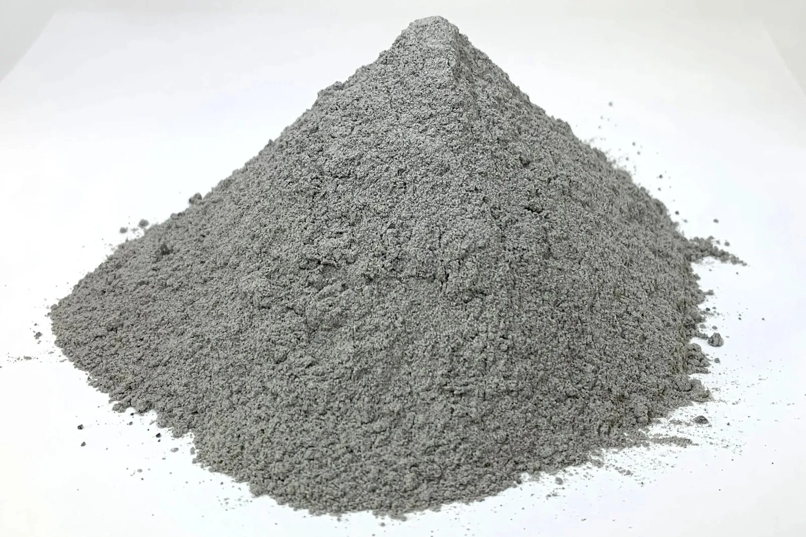 Pile of gray Off Planet Research lunar highlands regolith simulant on a white background