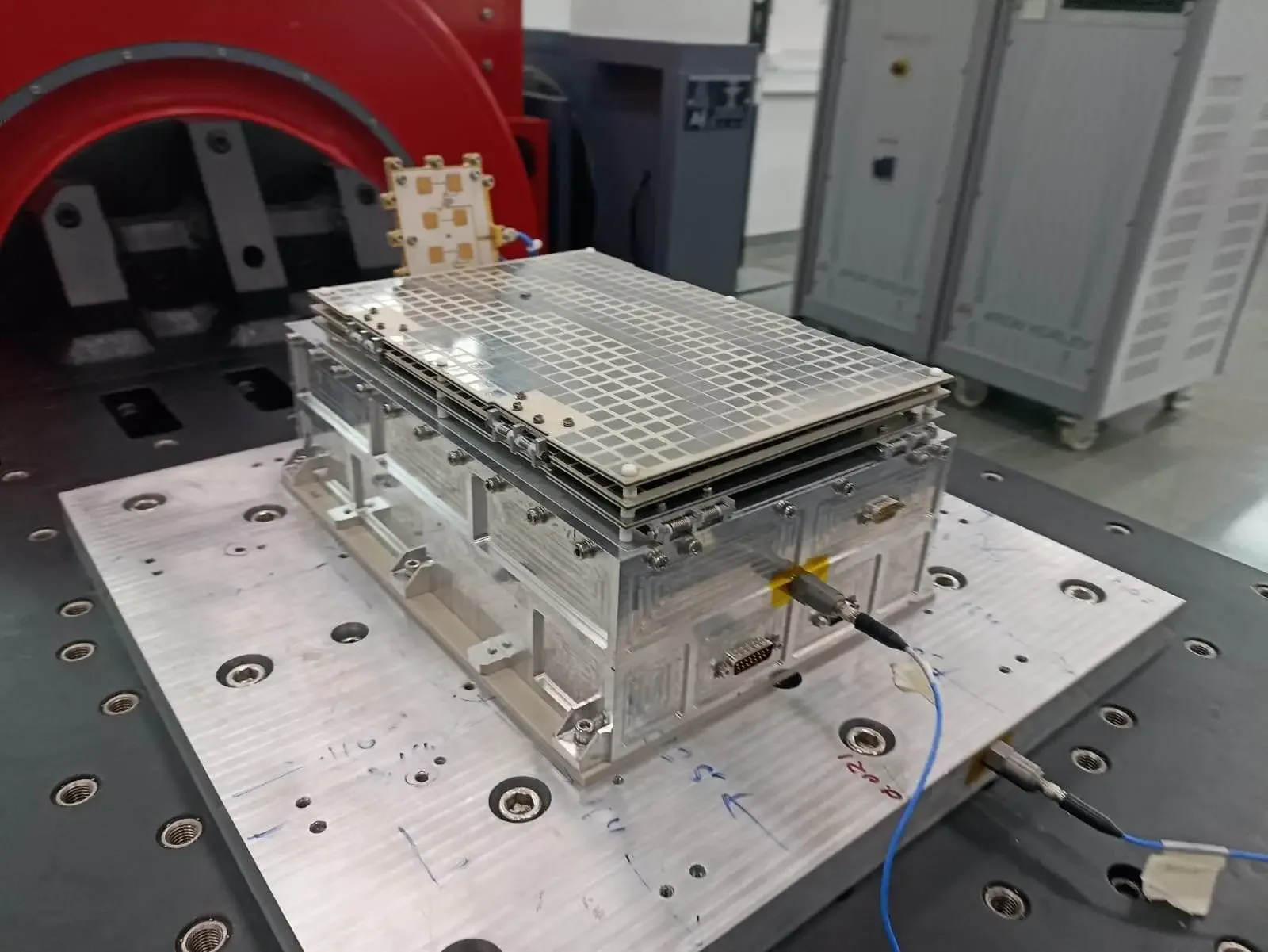 PierSight's Varuna radar satellite, with its flat antenna on top, mounted on a vibration test table