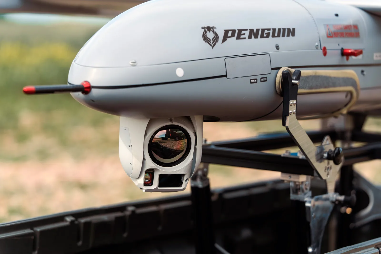 Redwire Octopus 140 LWIR gimbaled camera payload mounted under the nose of an uncrewed aircraft
