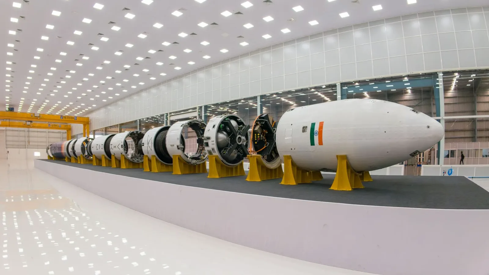 The Vikram-1 rocket's stages and payload fairing laid out horizontally on stands in a large assembly hall