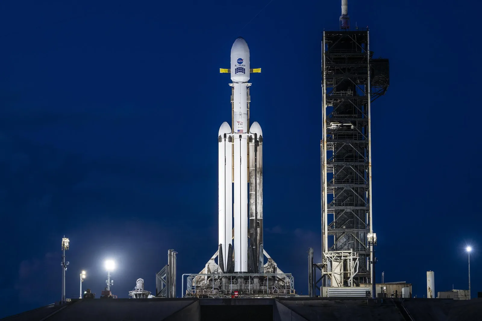 SpaceX Falcon Heavy standing vertical at Launch Complex 39A at dusk